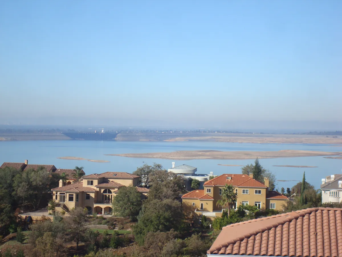 Folsom Lake seen from the foothills with lakeside homes in the foreground