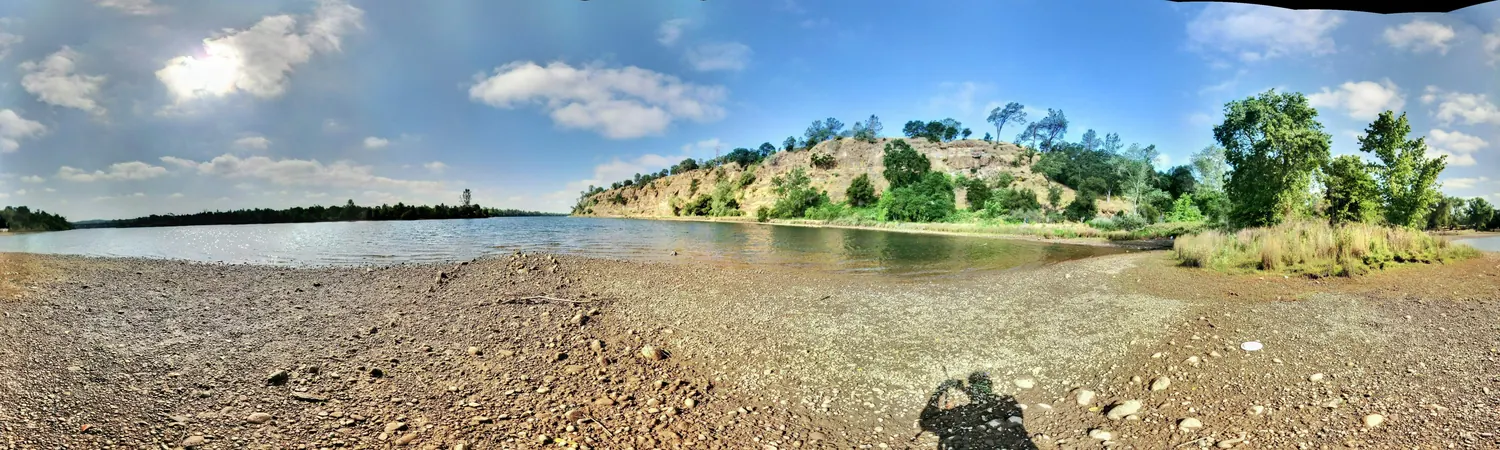 Lake Natoma and the American River at Negro Bar near Folsom with a rocky bluff